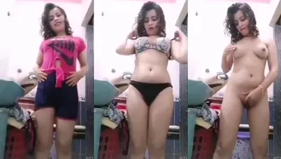 مصرية واقفه بتقلع الهدوم كاملة وتدلع وتفرك كسها