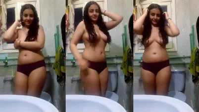 بنوتة جميلة واقفه في الحمام وبتعرض جسمها كامل وتدلع